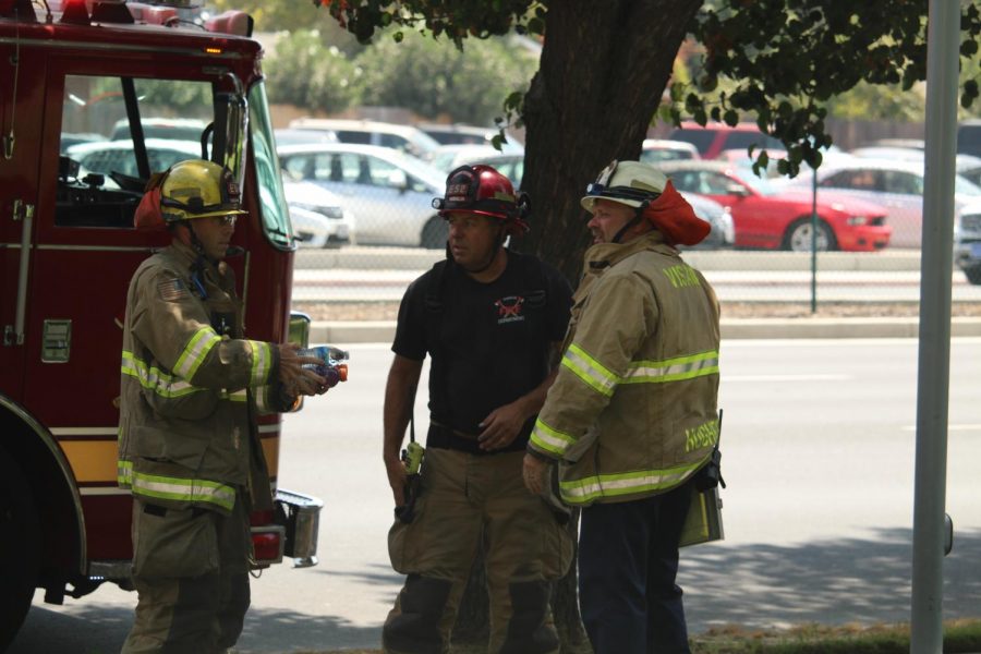 The+Visalia+Fire+Department+confers+on+the+scene.