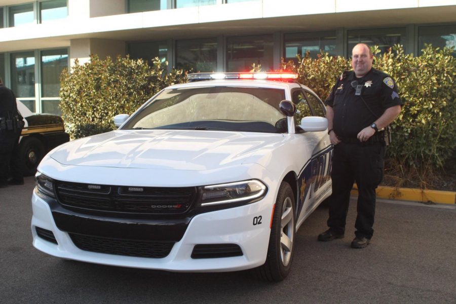 COS Police Sergeant Donald Charles stands next to his new Police Cruiser.