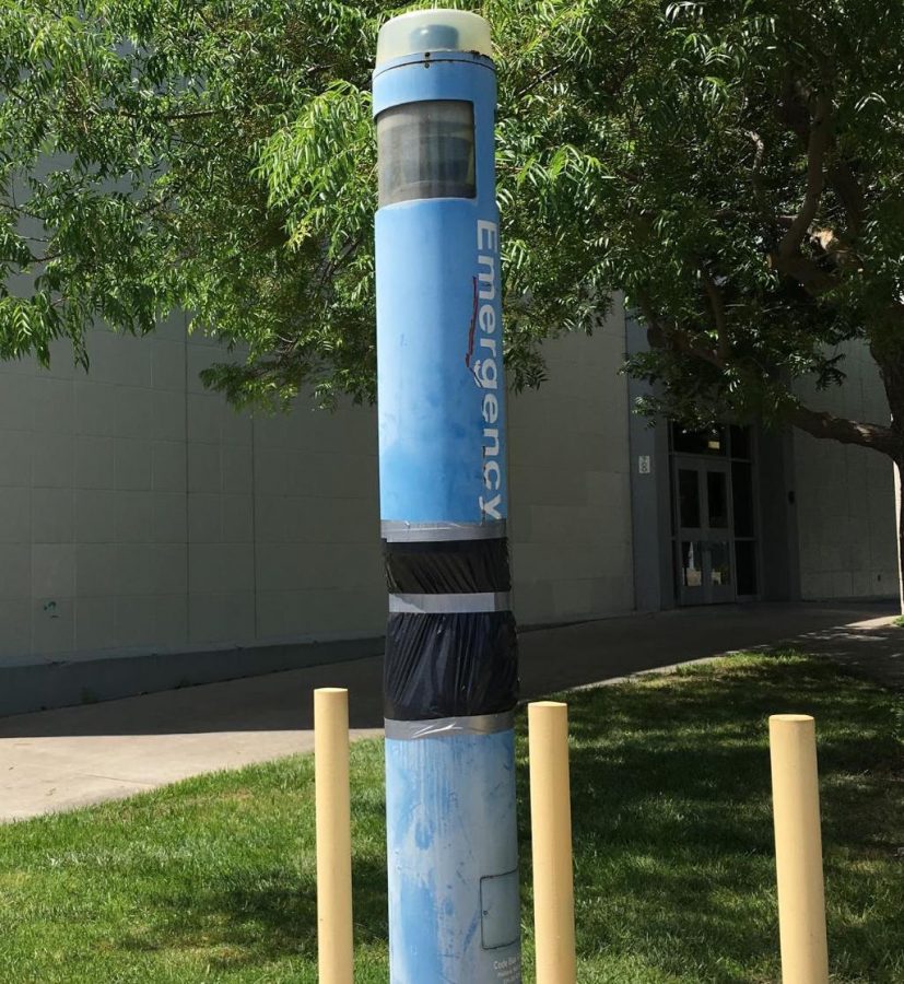 CODE BLUE Emergency phone covered in a black trash bag north of the Kern Building was out of service on Monday afternoon. Monday, May 6th, 2019, Visalia Campus.