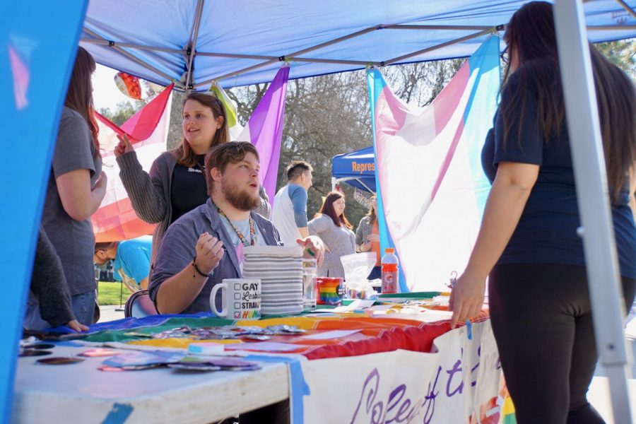 Pride Club President Patrick Hall informing students on what the club is all about and what they have to offer. 