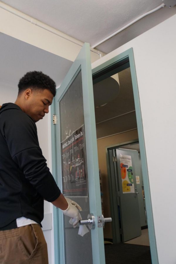 Kaleb Perkins, Age 22, Business Major, Health Center Student Worker Doing Everything He Can To Help Prevent The Spread Of The Corona Virus By Sanitizing Everything That Comes In Contact With people.