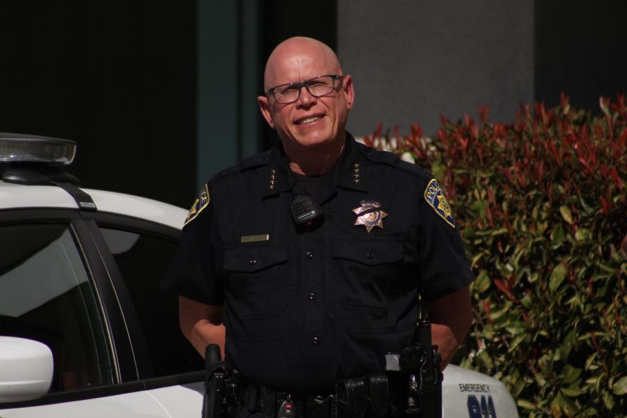 Chief Kevin Mizner stands near his patrol car on Wednesday, February 26, 2020. (Louie Vale/Visalia Campus)