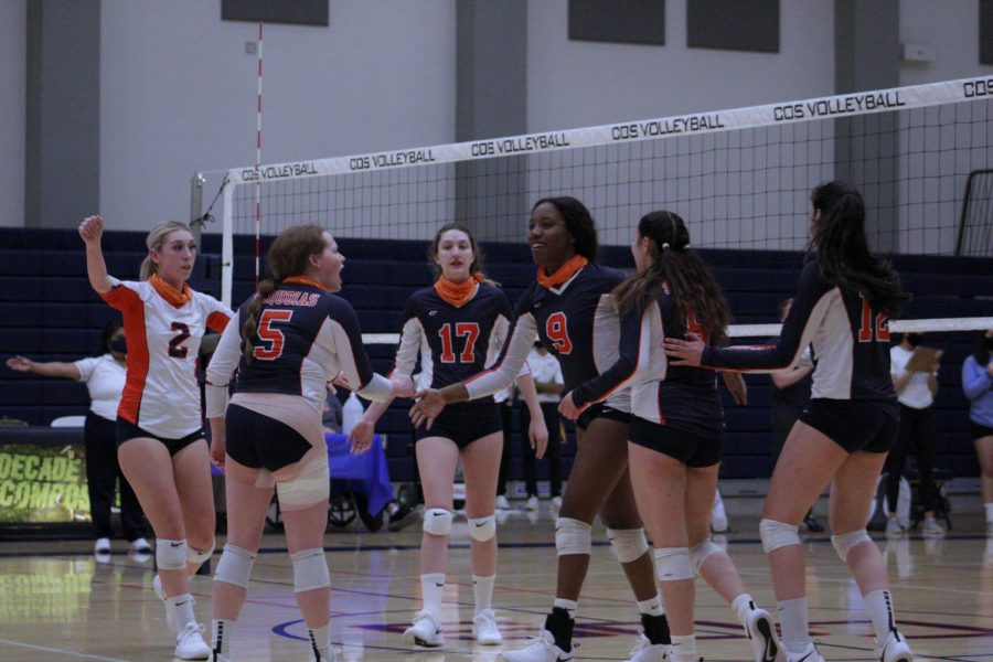 The Lady Giants are celebrating after getting a kill against Cerro Coso College