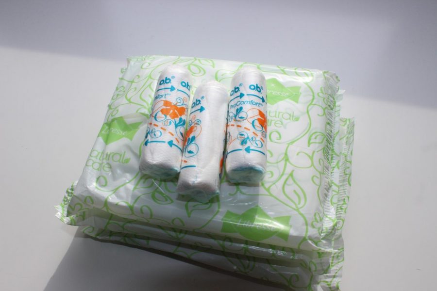 Stock photo of menstrual products, including three pads and three tampons